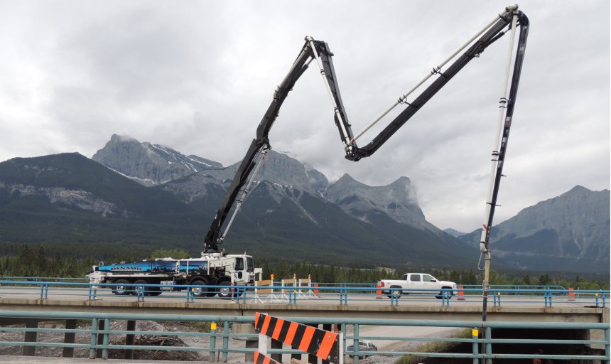 Dynamic Concrete Pumping boom pump working on the Trans-Canada, Canmore project