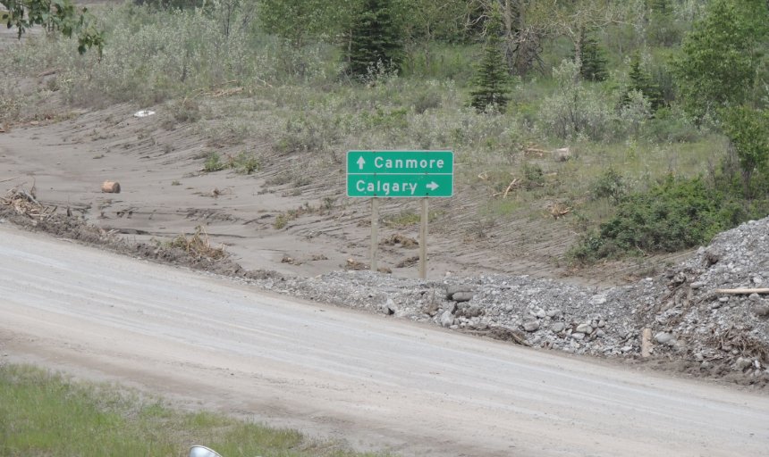 road sign directing drivers to Canmore and Calgary