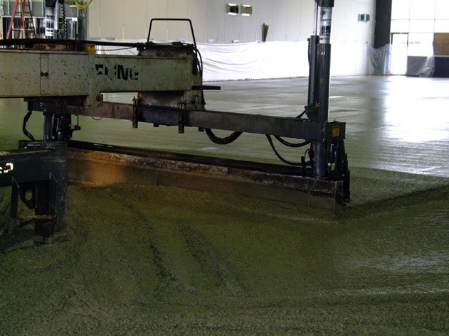 a laser screed machine placing floors at a Dynamic Concrete Pumping job site