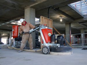 concrete contractor using a concrete polisher machine