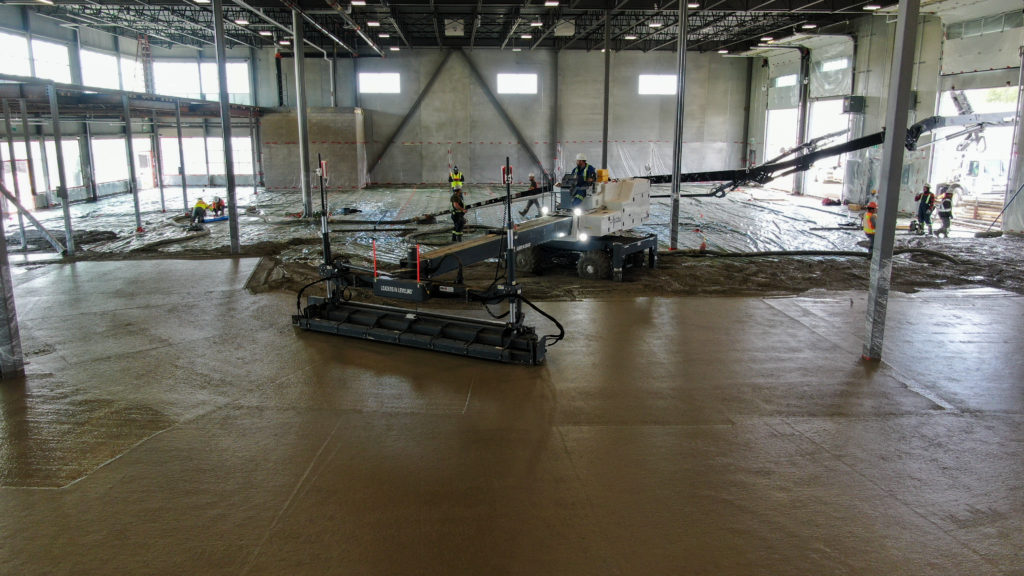 Dynamic Concrete Pumping contractors working on the floors of the HF11 industrial condo development job